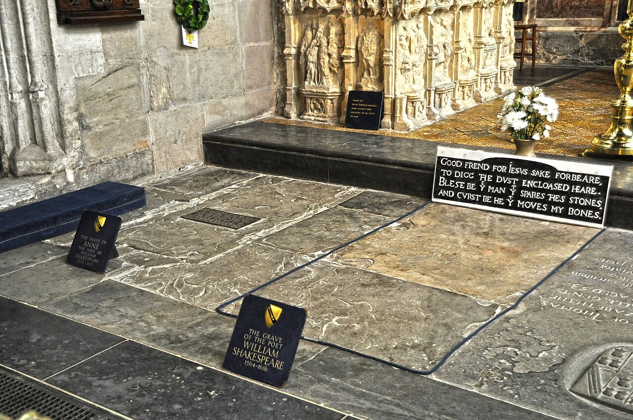 Shakespeare's Grave and Epitaph 1 Shakespeare’s gravestone in the chancel floor of Holy Trinity Church, Stratford-upon-Avon, with its four-line epitaph, a plaque reading “The grave of the poet William Shakespeare 1564–1616,” and his wife Anne’s grave beside it